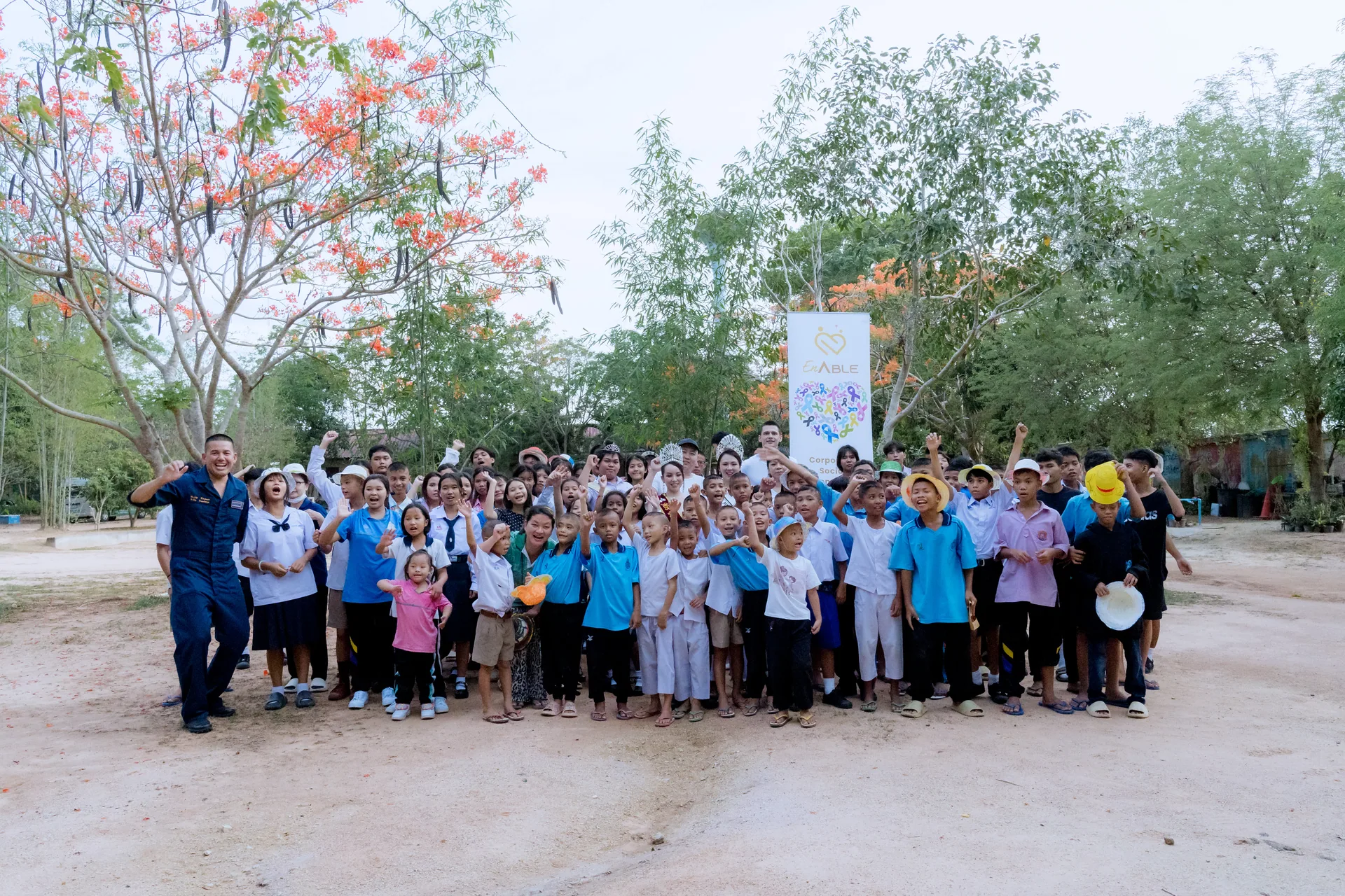 Children, volunteers, and guests gathered at Father Ray Children's Village